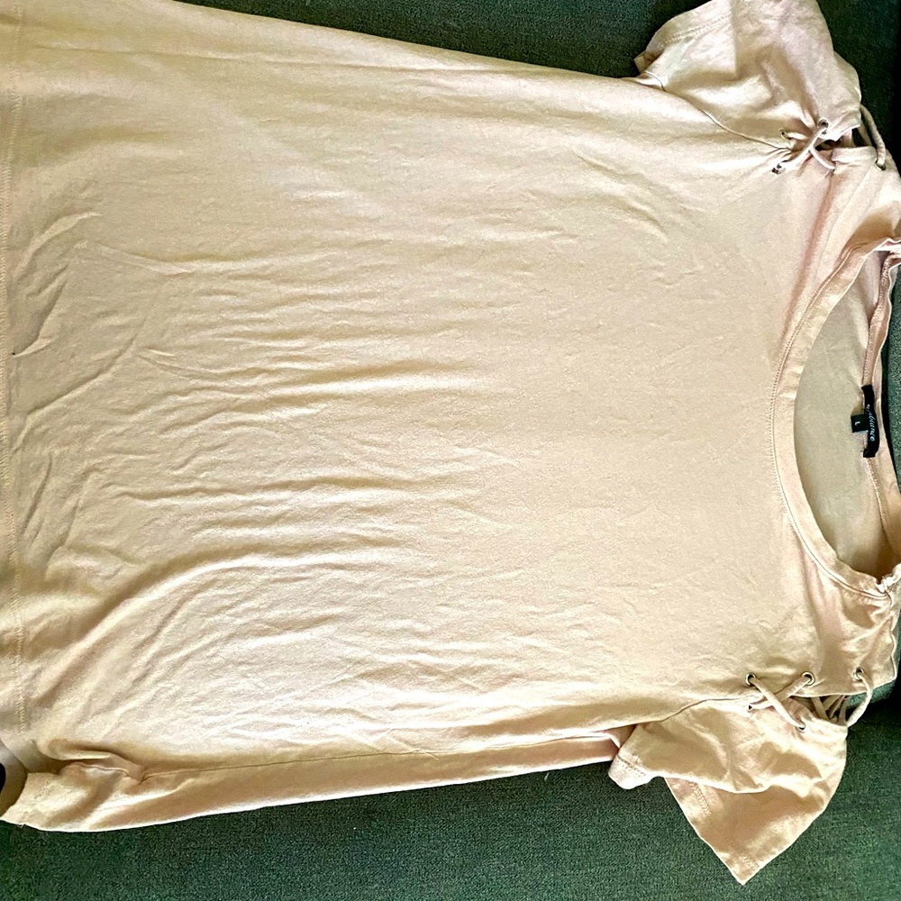 Very pale pink shirt.